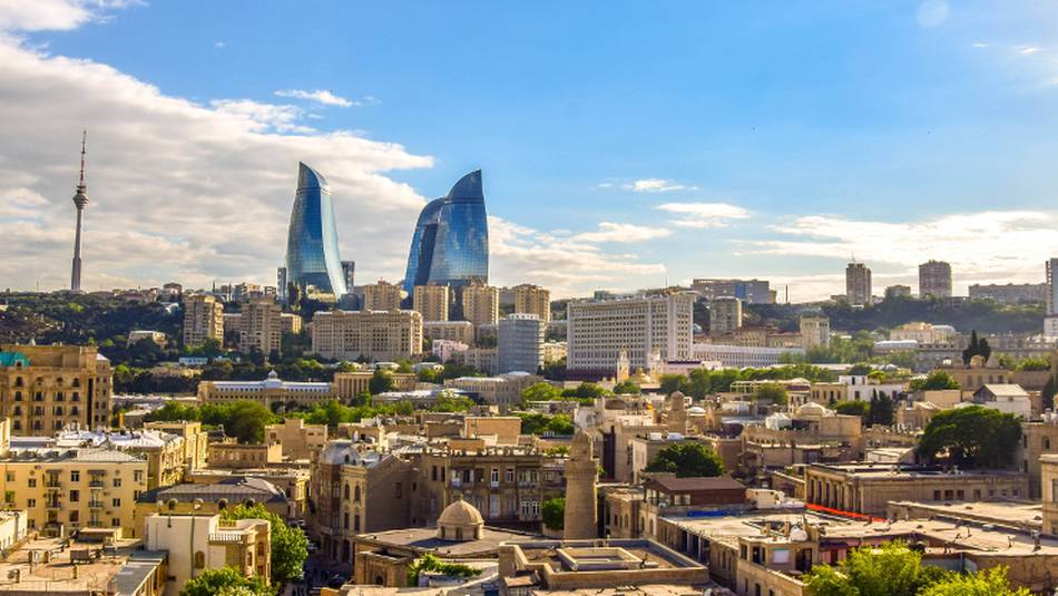 Baku, the cosmopolitan capital of Azerbaijan, where ancient Zoroastrian fire temples meet modern glass sky scrapers.