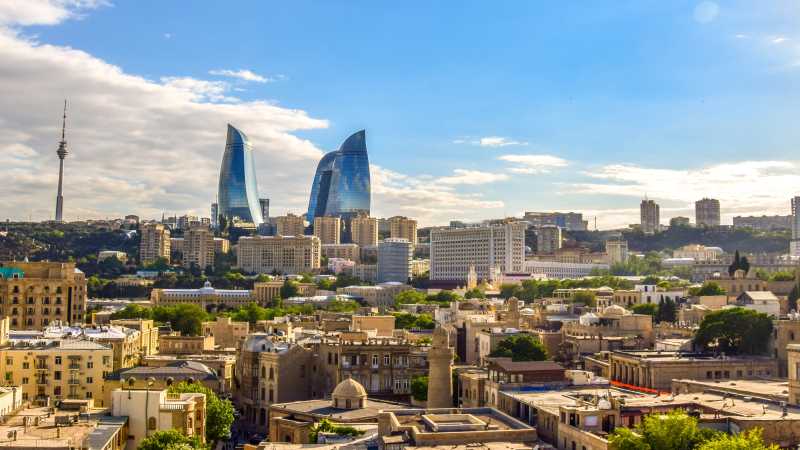 Baku, the cosmopolitan capital of Azerbaijan, where ancient Zoroastrian fire temples meet modern glass sky scrapers.