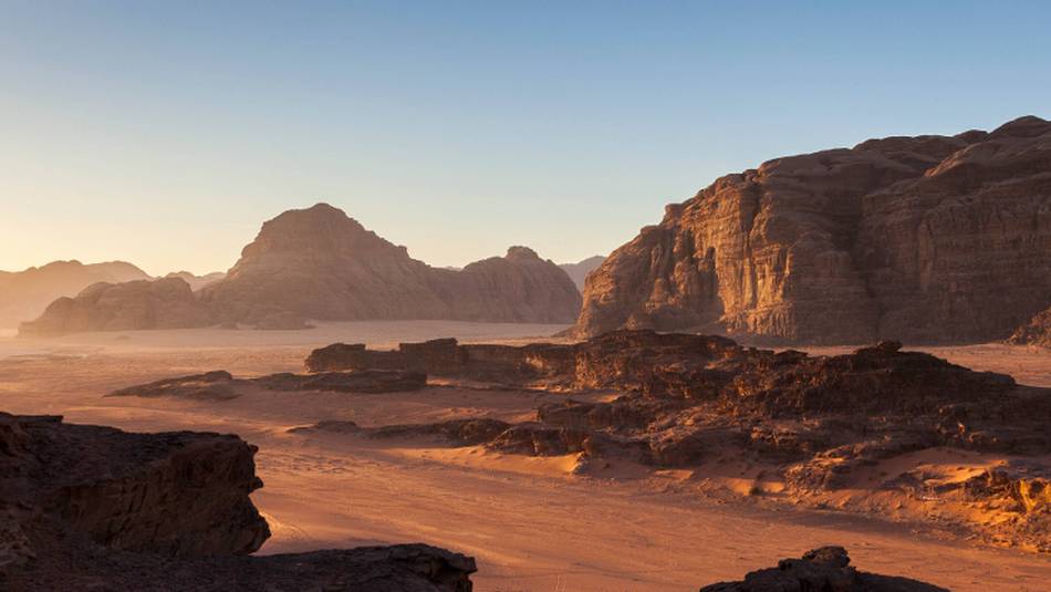 Wadi Rum's desert landscape at sunrise | Richard I'Anson