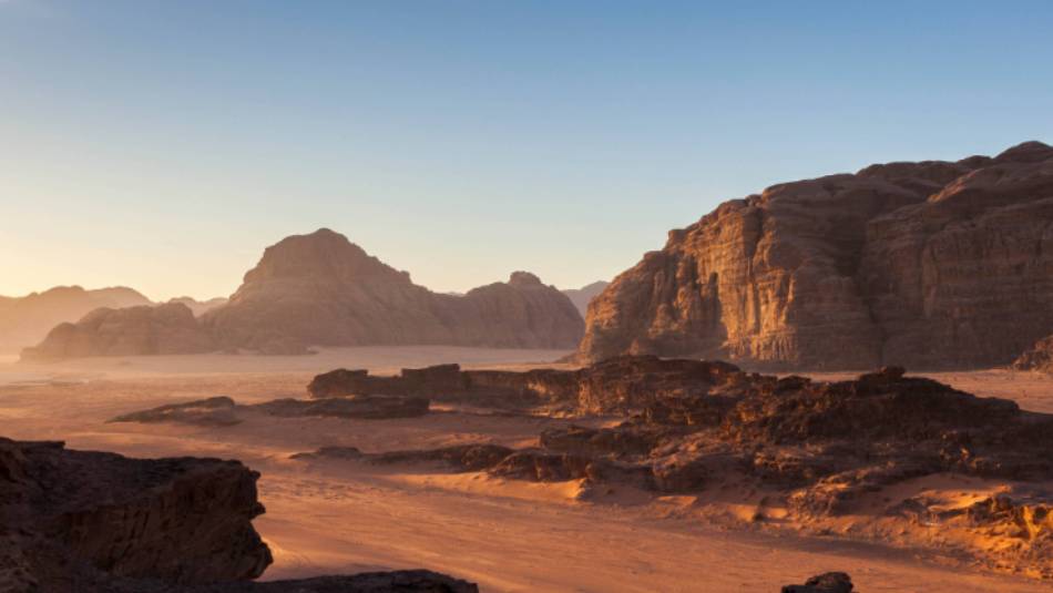 Wadi Rum's desert landscape at sunrise | Richard I'Anson