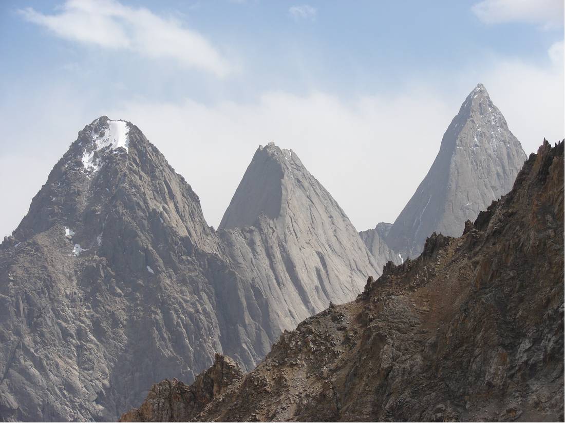 The towering sheer rock peaks of Asan (4,230m), Usen (4,378m) and Piramidalnyi (5,509m)