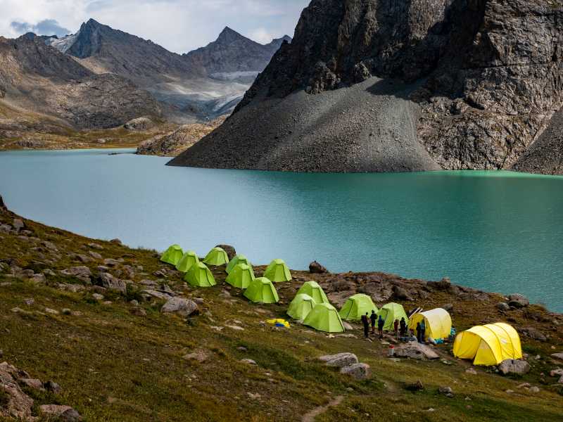 Camp by Ala Kol Lake | Lachlan Gardiner