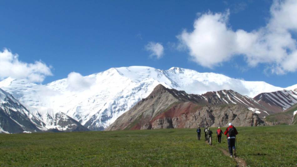 Trek through the luscious meadows in the valleys of Kyrgyzstan