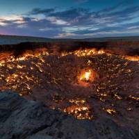 Turkmenistan's Darvaza Gas Crater, also known as the 'Door to Hell', at sunset | Richard I'Anson