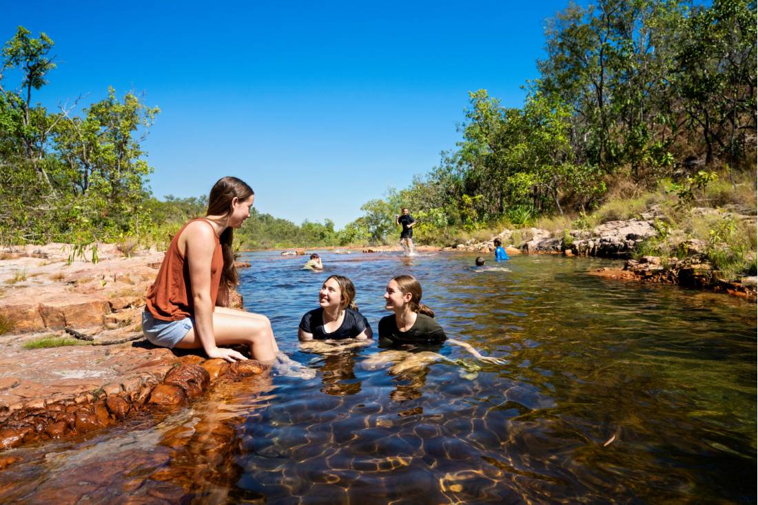 Kids cooling off during a walk in Kakadu National Park |  <i>Tourism NT/Shaana McNaught</i>