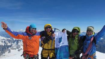 Happy climbers summitting Mt Blanc on an introductory climbing course