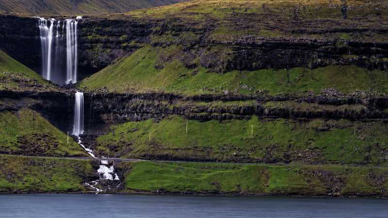 Waterfalls cascading down the Faroe Islands’ rugged coastline - Faroe Islands: Kayaking the North Atlantic, Faroe Islands