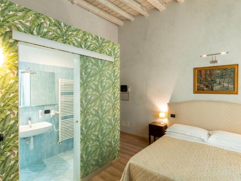 Verona hotel room with a sliding door to an ensuite bathroom