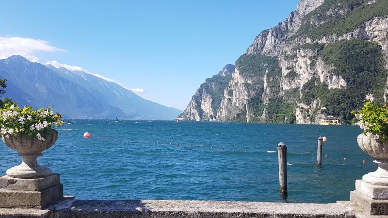 Lake Garda balcony with stone balustrade and flower urns overlooking the water - Alps to Aperitivo: Northern Italy with Ben Groundwater, Italy