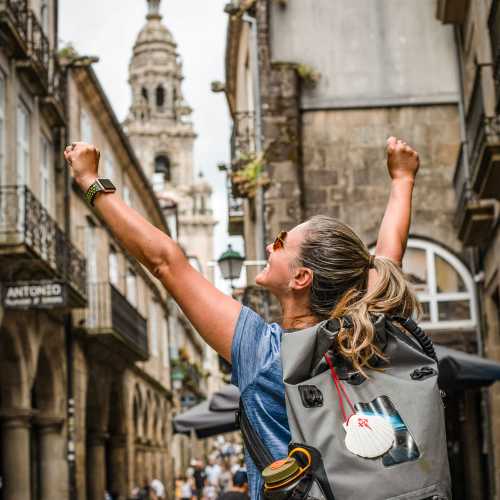 Celebrating the finish at Santiago de Compostela Cathedral