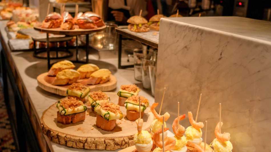 Try traditional pintxos (or tapas) at a bar in San Sebastian, Basque country, in Spain.