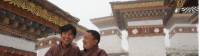 Two local Bhutanese men standing outside a temple |  <i>Liz Light</i>