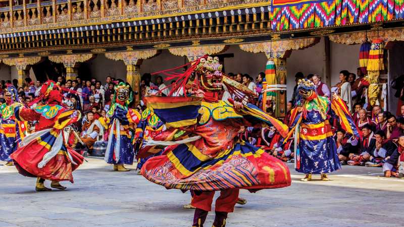 Bhutan's rich ceremonial celebrations include ornate masked dancers