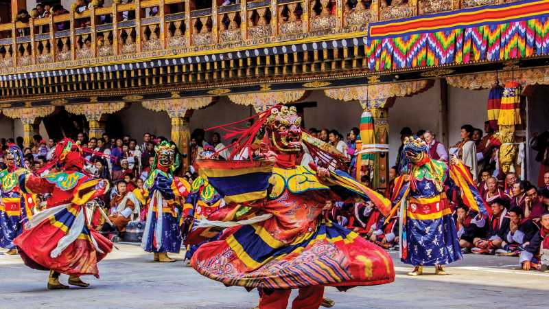 Bhutan's rich ceremonial celebrations include ornate masked dancers