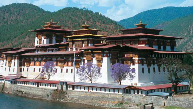 The Punakha Dzong in Western Bhutan is the winter residence of the Central Monk body and a highlight on our Himalayan Kingdoms Explorer. | Julie Anderson