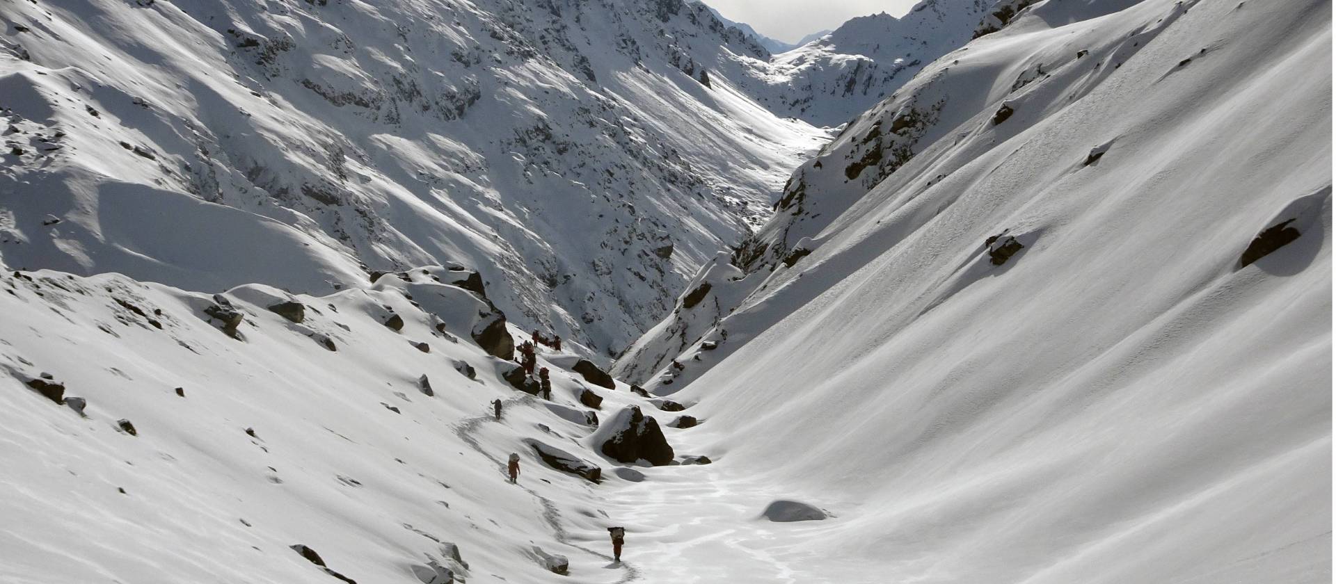 Trekking through a snowy valley during Stage 2 of the Great Himalaya Trail | Jasmine Star