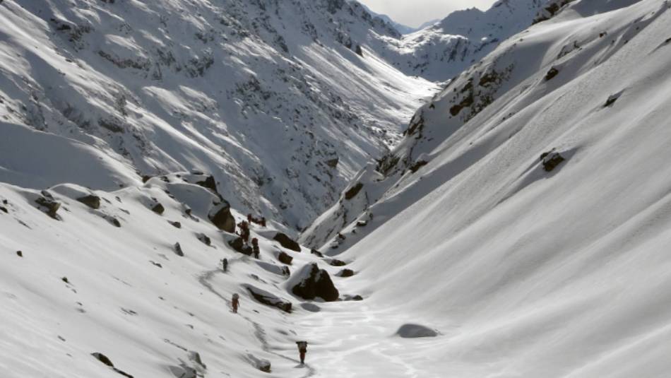Trekking through a snowy valley during Stage 2 of the Great Himalaya Trail | Jasmine Star