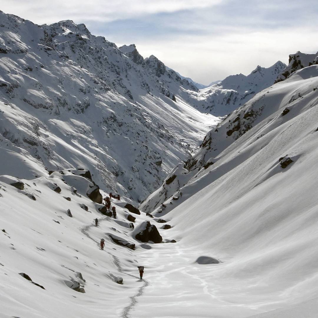 Trekking through a snowy valley during Stage 2 of the Great Himalaya Trail | Jasmine Star