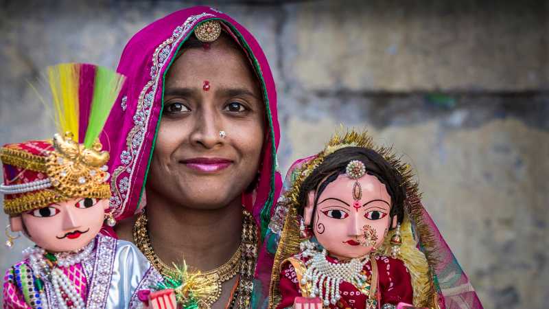 Local Udaipur women with idols of Lord Shiva and Mata Parvati | Richard I'Anson