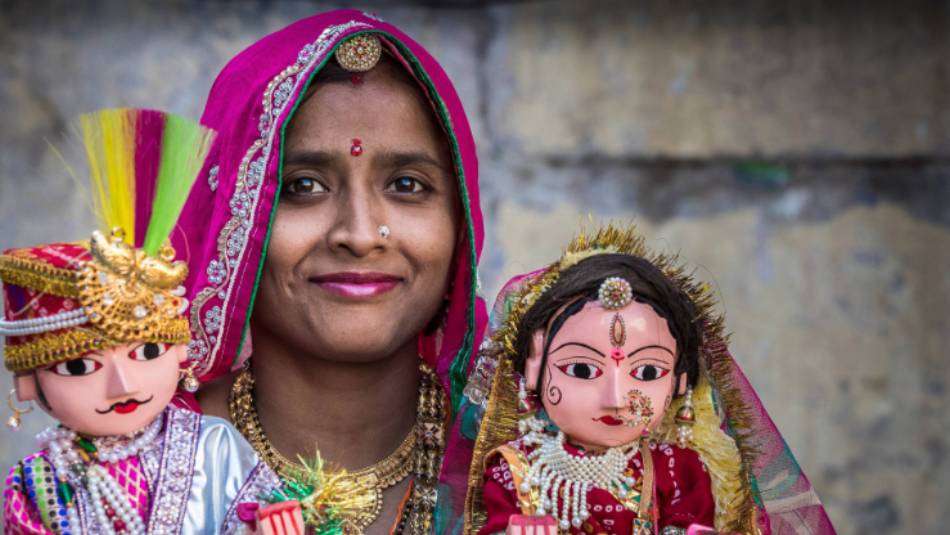 Local Udaipur women with idols of Lord Shiva and Mata Parvati | Richard I'Anson