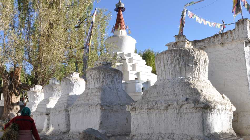 Walking past ancient chortens in Leh, Ladakh, where tradition and spirituality are deeply woven into daily life. | Garry Weare