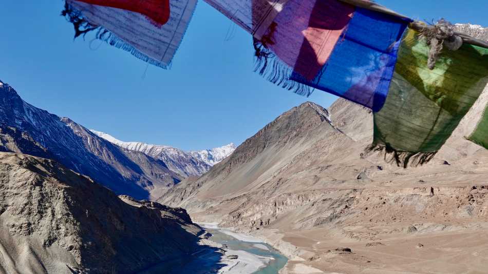 Prayer flags over Zanskar river | Margie Thomas