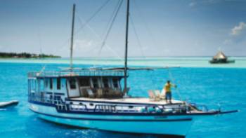 A traditional dhoni cruise is the best way to explore the turquoise waters of the Maldives
