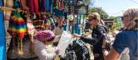 Interacting with a local shopkeeper along the trail | Joe Kennedy
