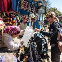 Interacting with a local shopkeeper along the trail | Joe Kennedy