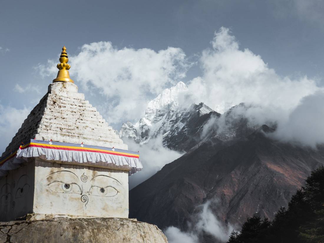 Buddhist Stupa beneath towering mountains |  <i>Kelvin Law</i>