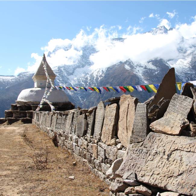 Mani stones that are inscribed with the Buddhist mantra "Om mani padme hum" | Ayla Rowe