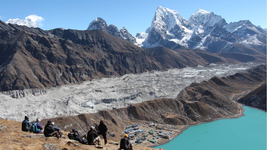 Trekking group taking a rest after walking to the summit of Gokyo Ri |  <i>Ayla Rowe</i>