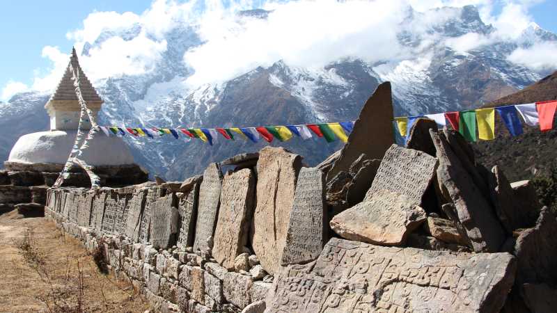 Mani stones that are inscribed with the Buddhist mantra "Om mani padme hum" | Ayla Rowe