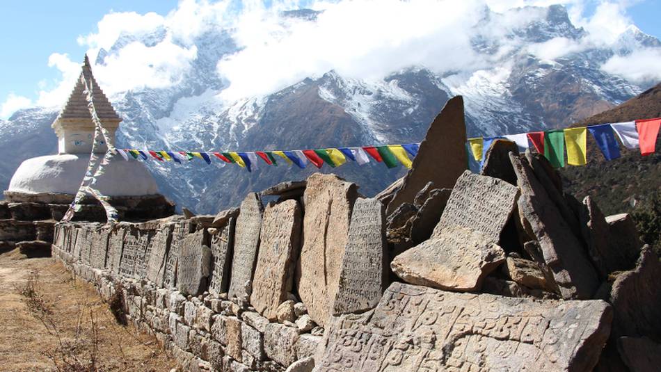 Mani stones that are inscribed with the Buddhist mantra "Om mani padme hum" | Ayla Rowe