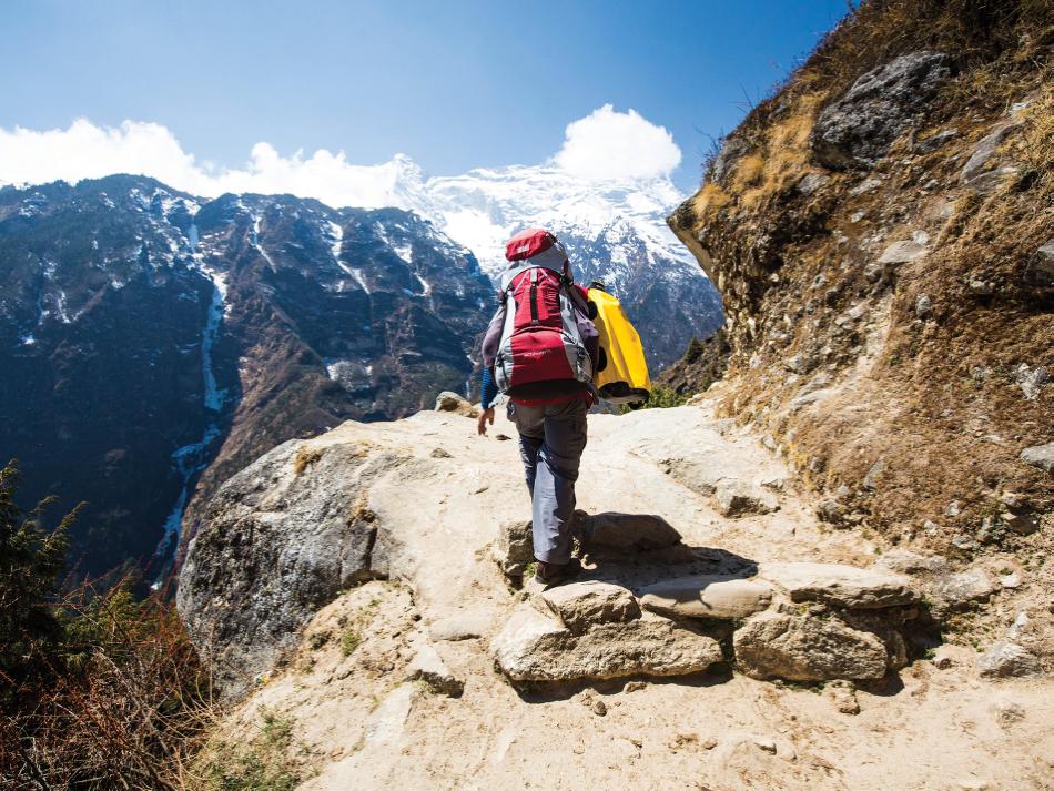 Trekking through the Everest region -  Photo: Mark Tipple