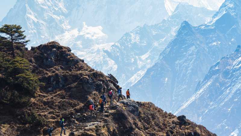 The trail to Thyangboche winds past the face of Ama Dablam | Mark Tipple