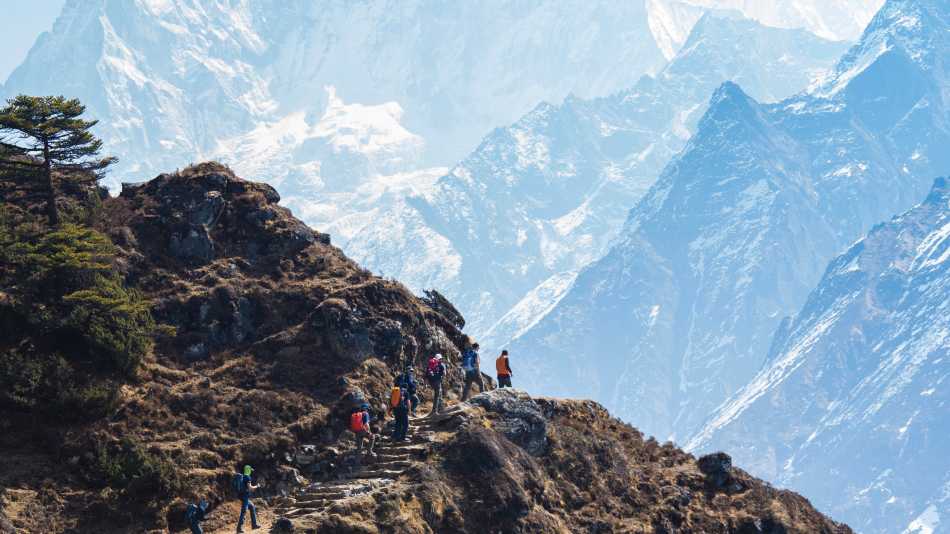 The trail to Thyangboche winds past the face of Ama Dablam | Mark Tipple