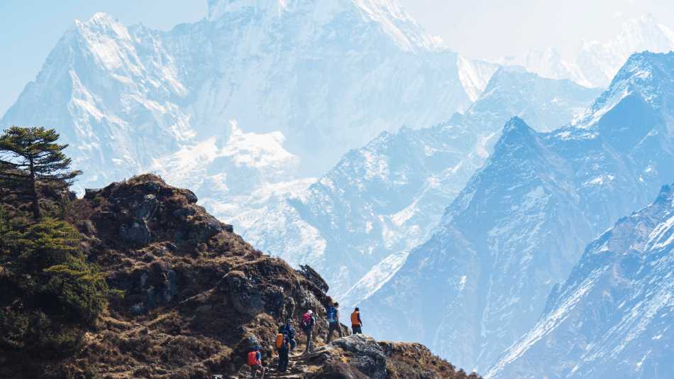 The trail to Thyangboche winds past the face of Ama Dablam | Mark Tipple