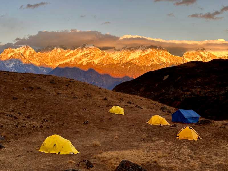 Golden light on Manaslu and Harka Gurung Himal at high camp | Tim Macartney-Snape