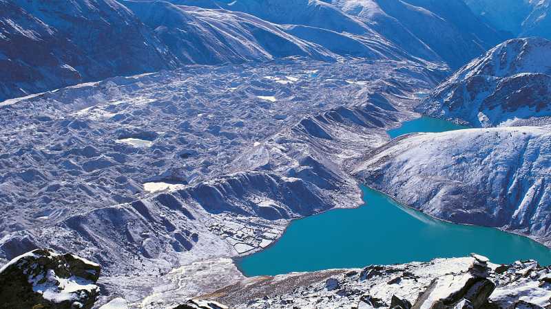 Gokyo Ri above the glacial waters of Gokyo Lakes | David Tatnall