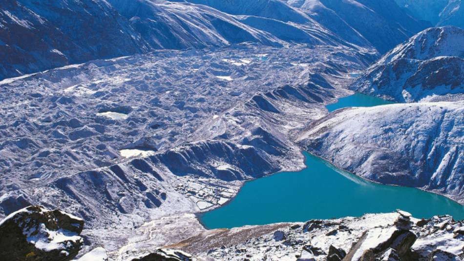Gokyo Ri above the glacial waters of Gokyo Lakes | David Tatnall