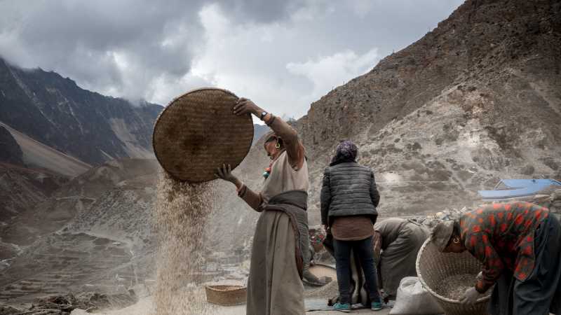 Locals go about their business in the village of Nar | Stephen White