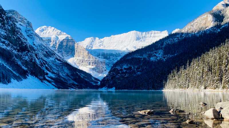 Admiring the crystal clear water of Lake Louise | Caroline Mongrain