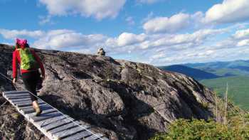 Bridges cross peaks and cut through forest on the Charlevoix Traverse