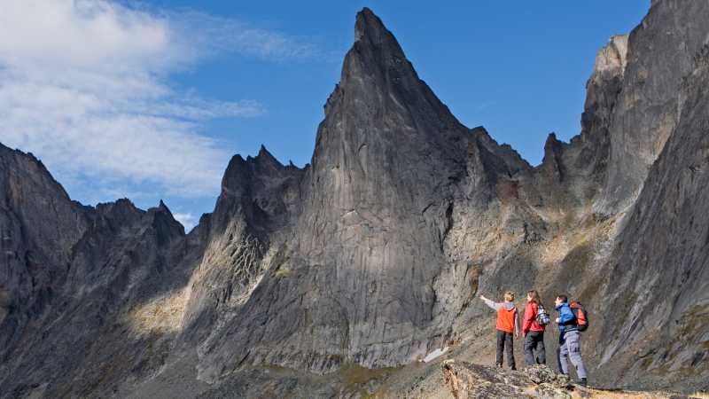 A captivating mountain range by a pristine lake in Tombstone Territorial Park | Government of Yukon/Fritz Mueller