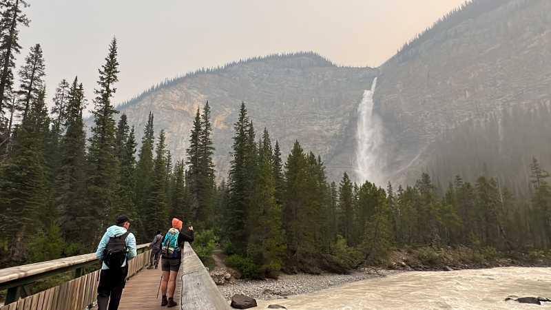 Crossing the bridge to the foot of Takakkaw Falls in Yoho National Park | Kalaya Mckenzie