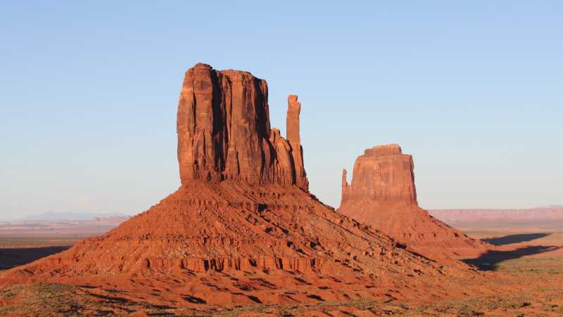 The Monument Valley buttes, on the Utah - Arizona border, lights up at sunset | Brad Atwal