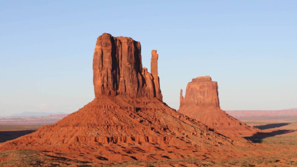 The Monument Valley buttes, on the Utah - Arizona border, lights up at sunset | Brad Atwal