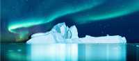 Aurora Borealis lights up the fjord in Greenland