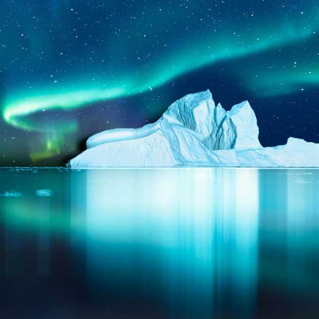 Aurora Borealis lights up the fjord in Greenland